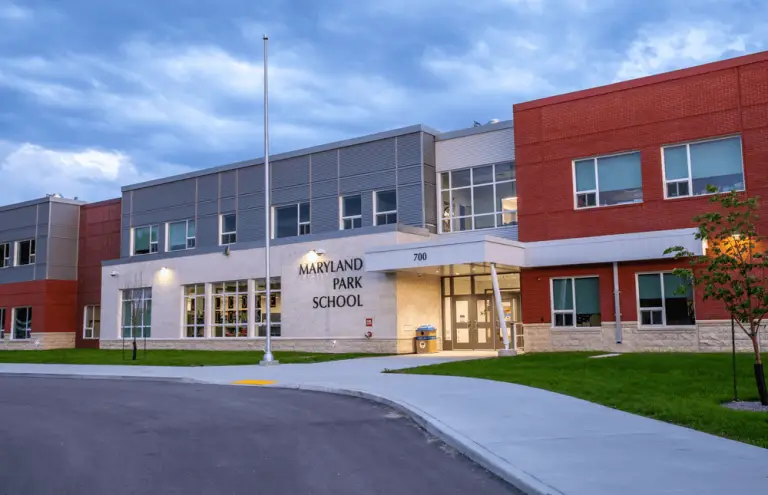 Maryland Park School exterior: A modern school building with large windows, showcasing the innovative design and energy efficiency of the facility.