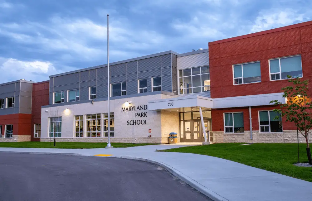 Maryland Park School exterior: A modern school building with large windows, showcasing the innovative design and energy efficiency of the facility.