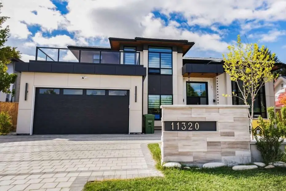 A modern home with a clean, symmetrical design and a stylish front door.
