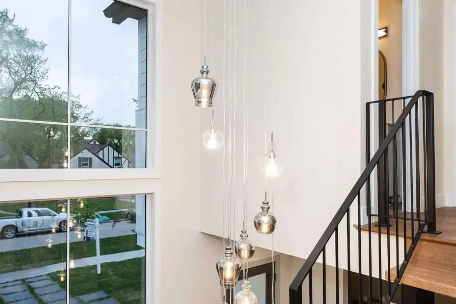 modern farmhouse-style home with black windows by SILEX