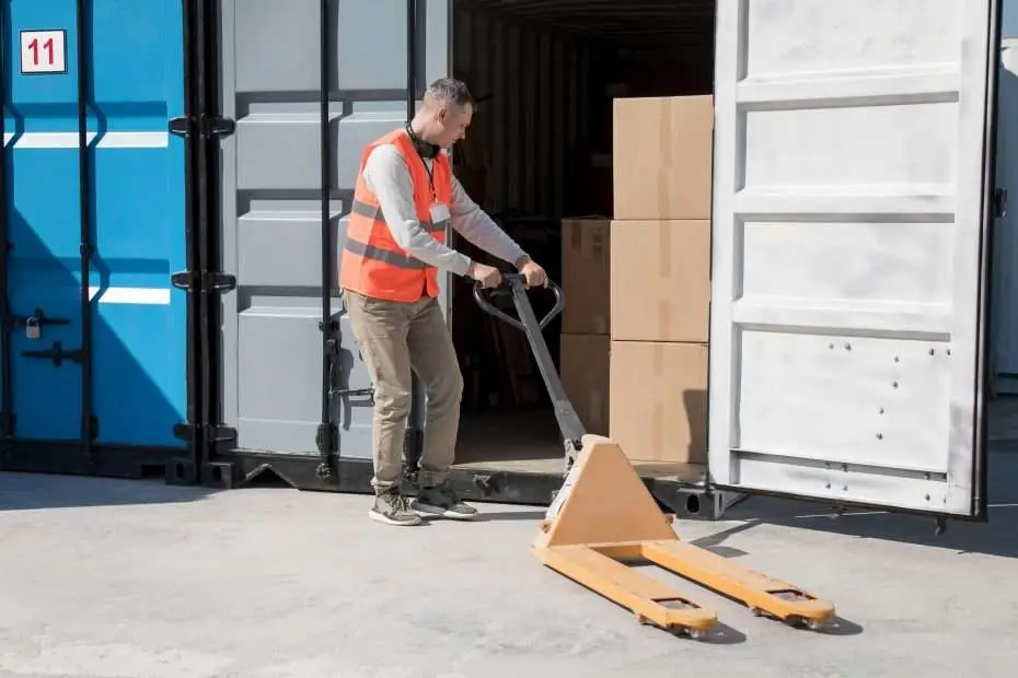 Worker handling building materials for window and door manufacturing