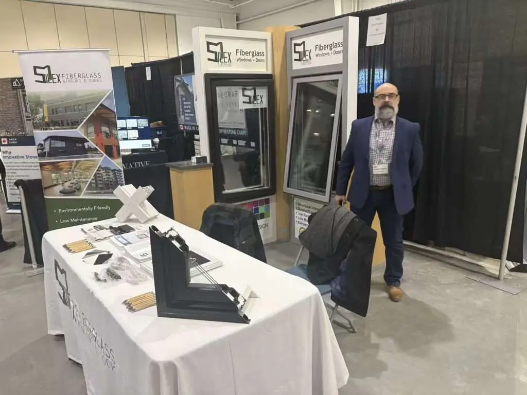 SILEX fiberglass windows booth with display samples and visitors from the Prairie construction industry.