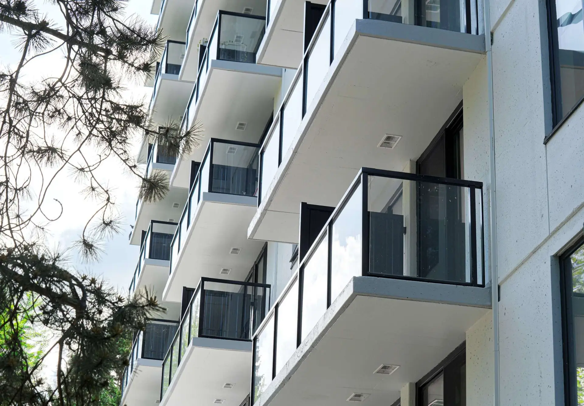 lose-up of the smooth-glide roller track system on an installed SILEX fiberglass patio door inside a Westsea Place apartment unit in Vancouver.