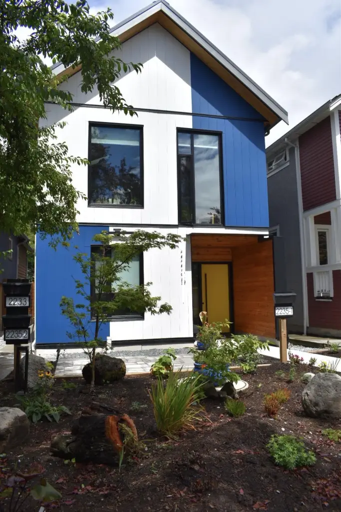 Contemporary home featuring triple-glazed windows with black interior and exterior frames.