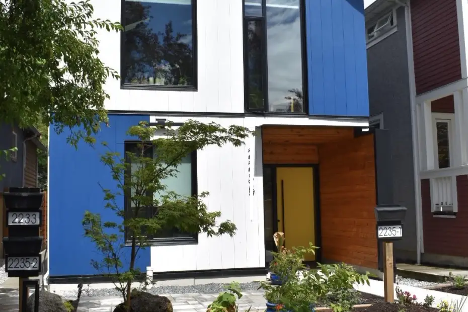 Contemporary home featuring triple-glazed windows with black interior and exterior frames.